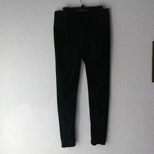 Black skinny cut pants with paisley velvet design